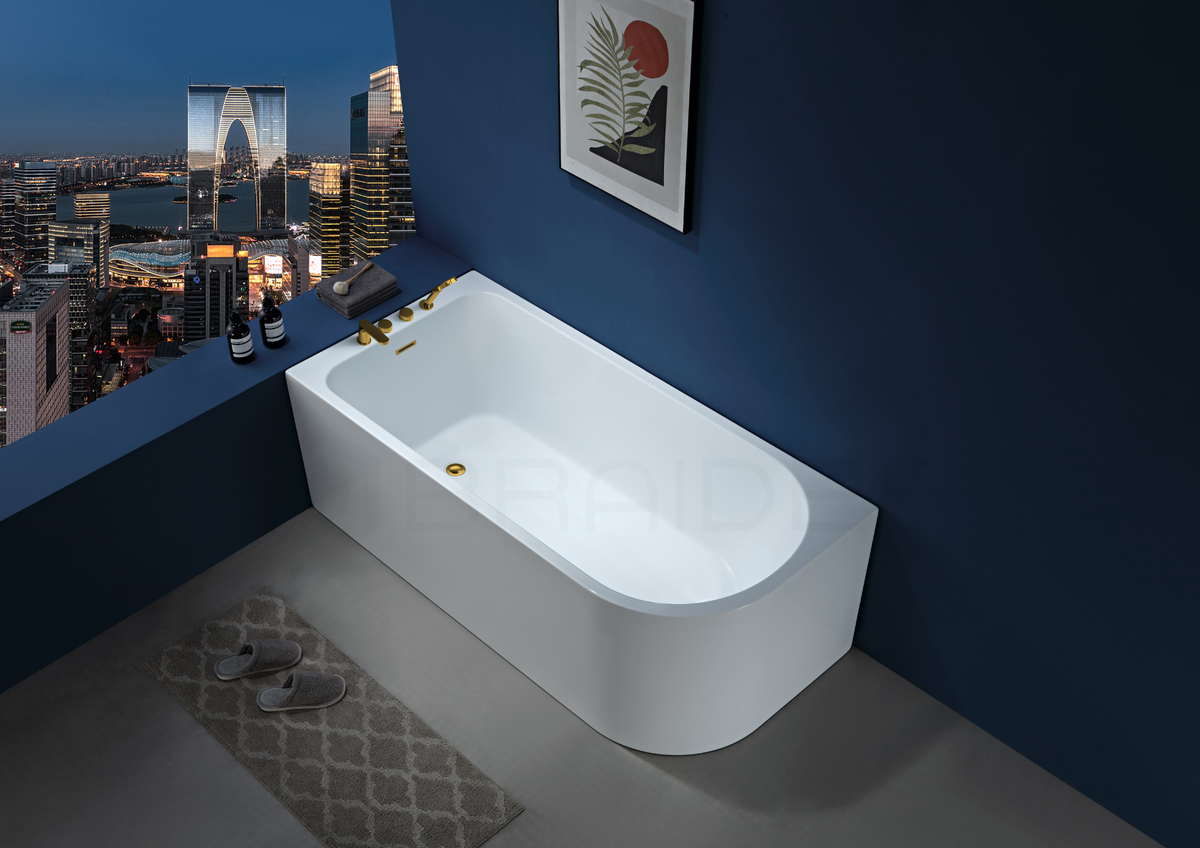 A modern freestanding white bathtub. Corner bath, J Shaped 