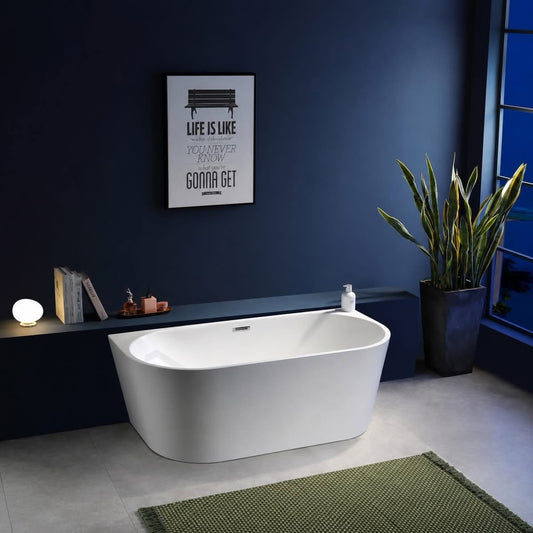 A freestanding oval bathtub in white, placed in a modern bathroom. Acrylic back to wall bath